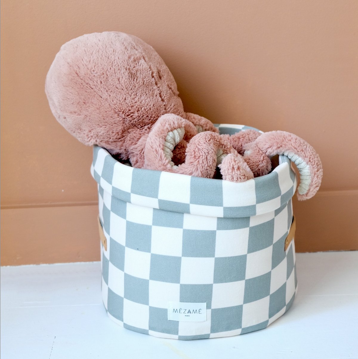 small green checkerboard toy storage basket