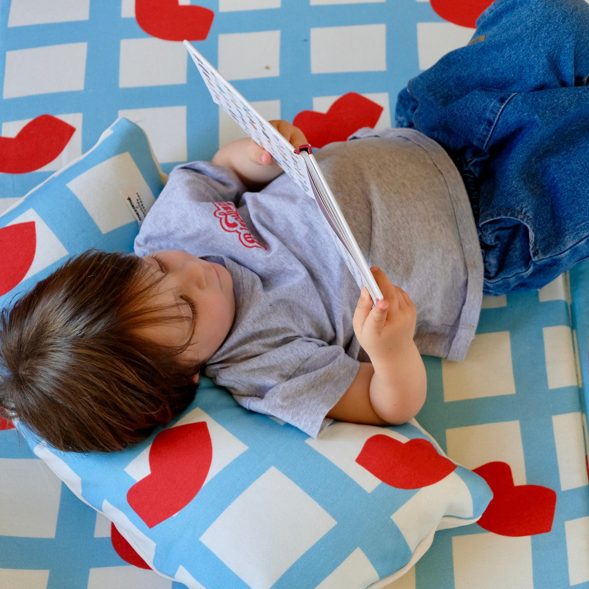 super soft cushion for parents and children with kiss mouth print by mathilde cabanas 